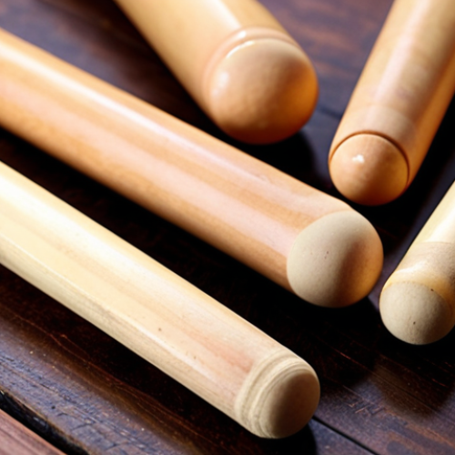 Home 4 **
A close-up shot of various drumsticks (7A, 5A, 5B, 2B) with different thicknesses laid out on a wooden surface. Focus on the difference in diameter and how it might feel in a hand. The background is blurred, perhaps a drum set in the distance.
**